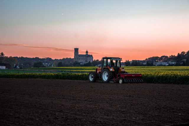 tractor beside grass field